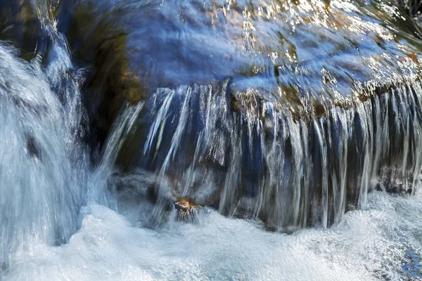 clear mountain running water, note shallow depth of field