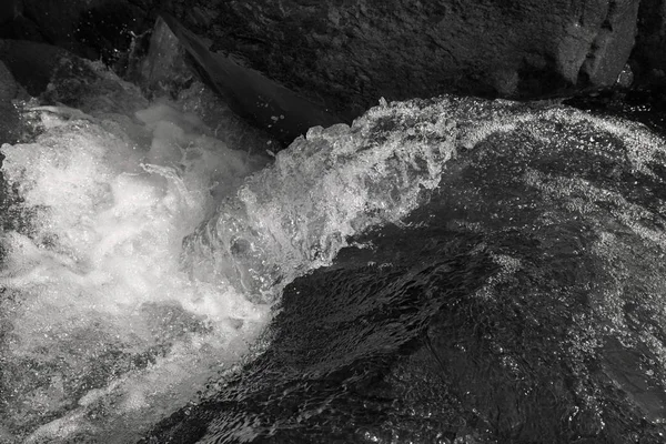 clear mountain running water, note shallow depth of field