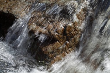 stone under the mountain water, note shallow depth of field