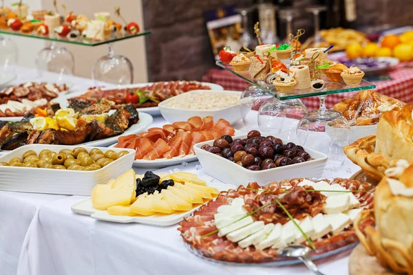 decorated Swedish table with a variety of good food, note shallow depth of field