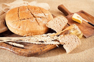 Decoration  with round integral bread on wooden board, note shallow depth of field