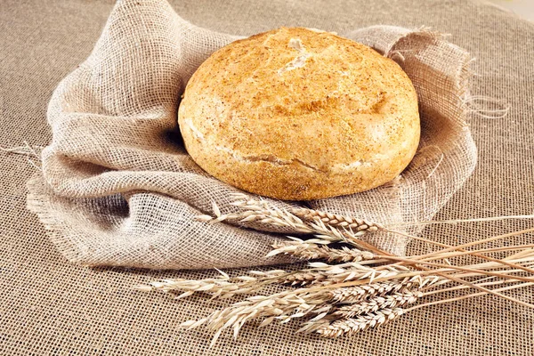 Round corn bread on a linen cloth, note shallow depth of field