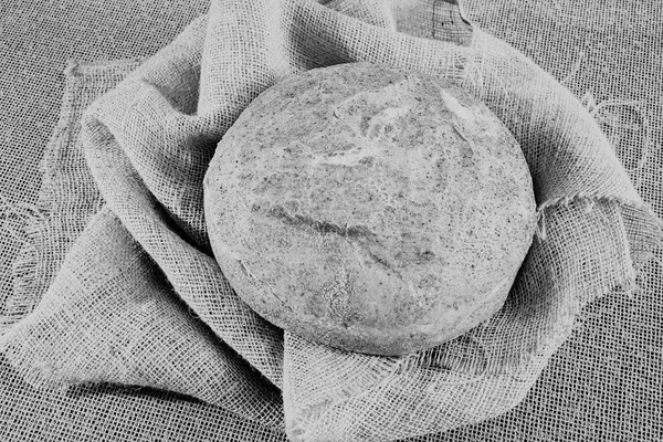 Round corn bread on a linen cloth, note shallow depth of field