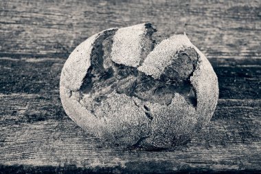 round fresh homemade bread on a wooden board