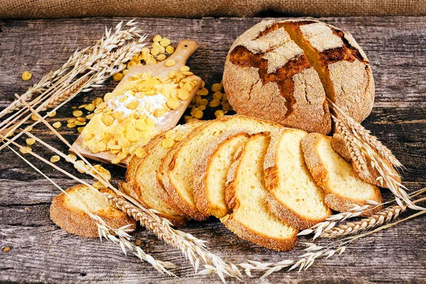 Decoration with corn bread and cereals on a wooden board, note shallow depth of field