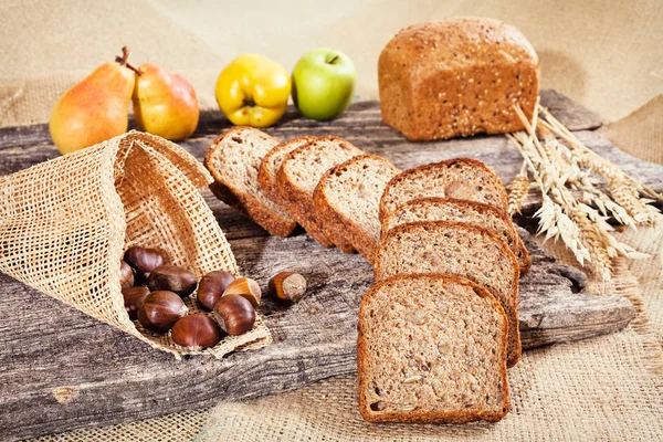 Decoration Rye Bread Wooden Board Chestnuts Cone Fruit Dry Twigs — Stock Photo, Image