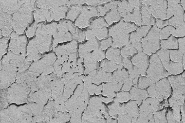 Çatlak cepheli ve beyaz arkaplanı olan soyut eski duvar