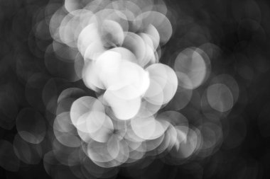 bulanık arkaplan için siyah arkaplan üzerindeki beyaz ışıktan türetilmiş gri soyutlama