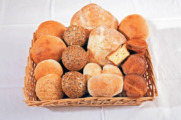 various kinds of bread  made from various flour in  a wicker basket