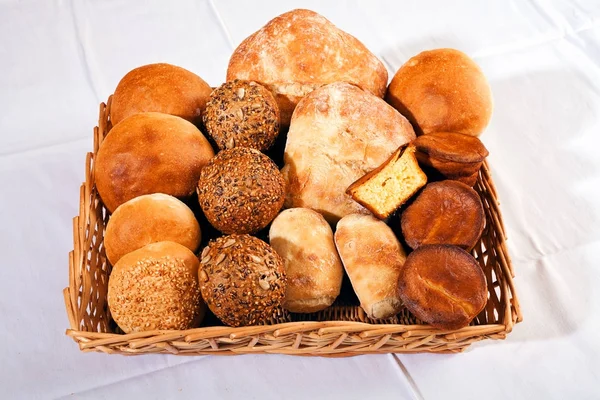 various kinds of bread  made from various flour in  a wicker basket