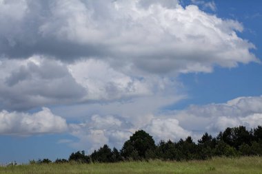 Clouds over the field on a cloudy day, note shallow depth of field