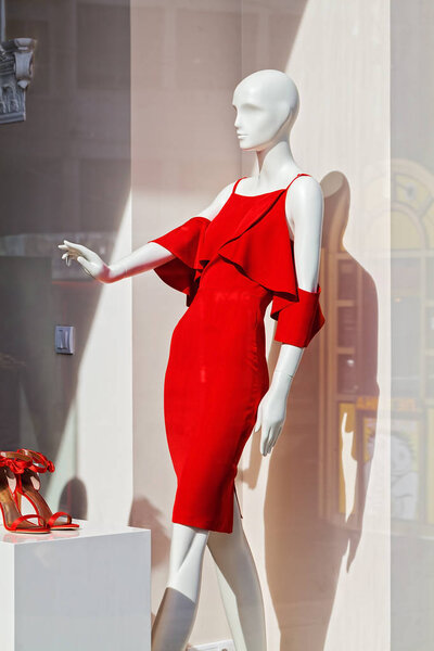 doll with red dress in the shop window, note shallow depth of field