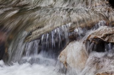 stone under the mountain water, note shallow depth of field