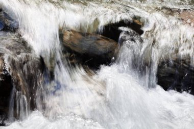 clear mountain running water, note shallow depth of field