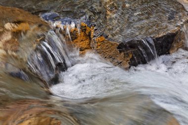 stone under the mountain water, note shallow depth of field