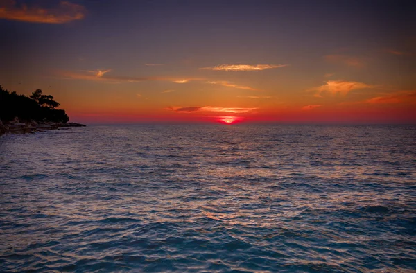 Tropical sunset on the beach, near Rovinj, Croatia — Stock Photo, Image