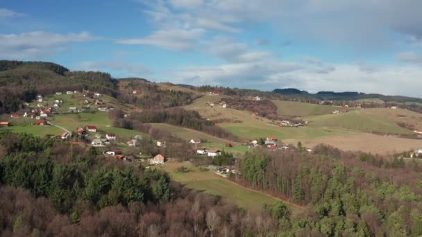 Kovaca vas on Pohorje near Slovenska Bistrica, Slovenia, aerial view of rural landscape and rolling hills, houses scattered between forest, meadows and vineyards — 비디오