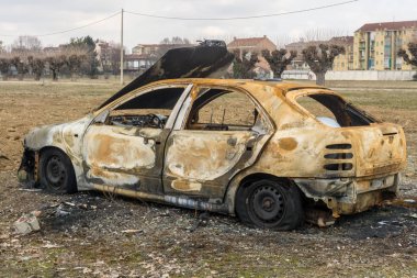 An abandoned, stolen burnt out car clipart