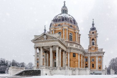 Basilica di Superga church during a snowing in Turin. clipart