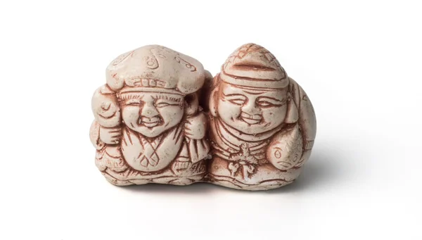 Netsuke voor twee vissers met hun vangst. Geïsoleerd. Een miniatuur — Stockfoto