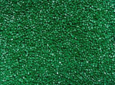Plastik granül. Polimer boya yeşil arka planı için. D