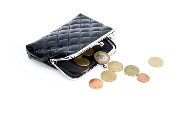 Coins from the old wallet on a white background. Vintage empty purse. The concept of poverty in retirement. — Stock Photo, Image
