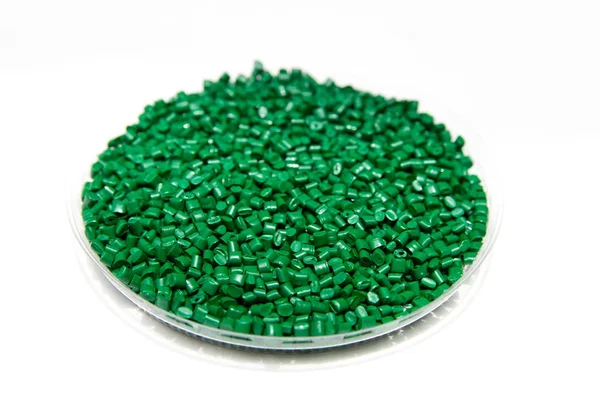 Plastic pellets green. Colorant for polymers in granules. — Stock Photo, Image