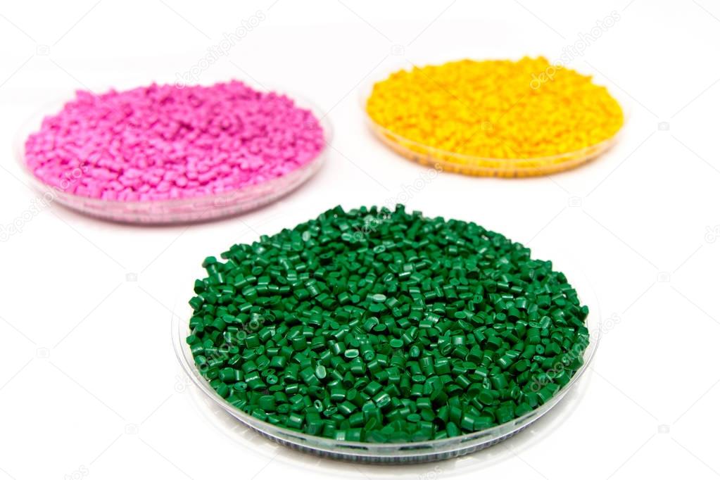 The plastic granules. Dye for polypropylene, polystyrene granule into a measuring container