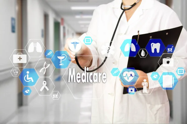 Medical Doctor with stethoscope and Medicare icon in Medical net — Stock Photo, Image