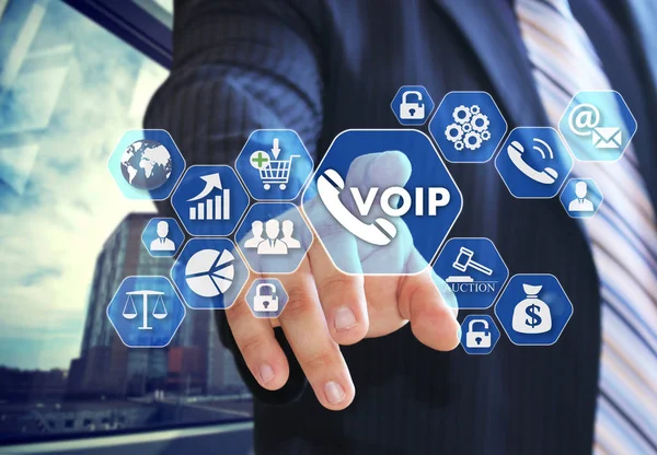 The businessman chooses VOIP on the virtual screen in social net — Stock Photo, Image