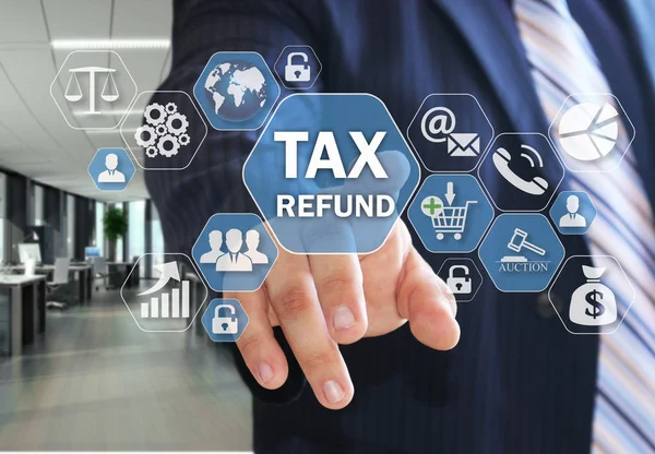 The businessman chooses TAX REFUND on the virtual screen in soci — Stock Photo, Image