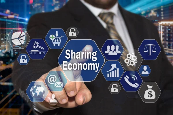 The businessman chooses the Sharing Economy  on the virtual scre — Stock Photo, Image