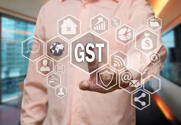 An elderly businessman chooses GST, Goods and Service Tax on the — Stock Photo, Image