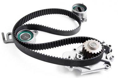 Kit of timing belt with rollers on a light background. clipart