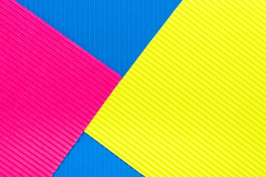 Pembe mavi ve sarı renkli kağıt doku arka plan oluklu. 