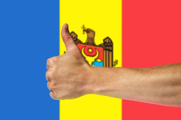 Thumbs up on a background of a flag of Moldova — Stock Photo, Image