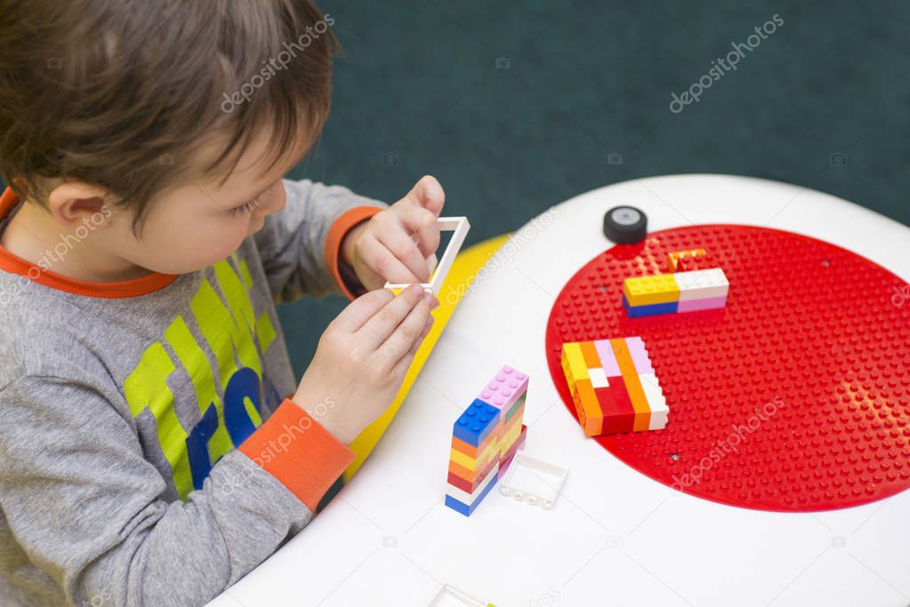 The child collects the Designer. Kids activity in kindergarten or at home