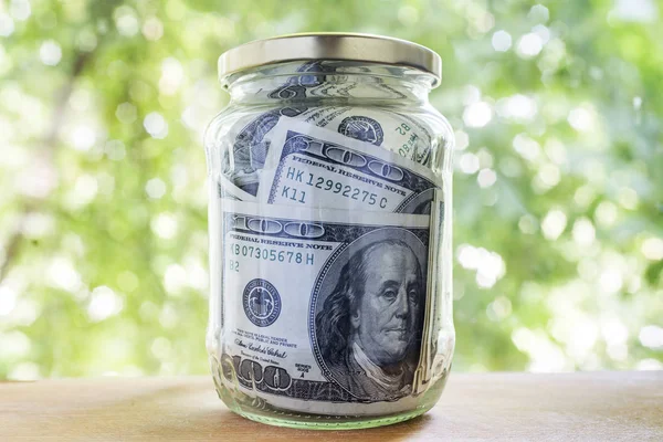 Money in a glass jar — Stock Photo, Image