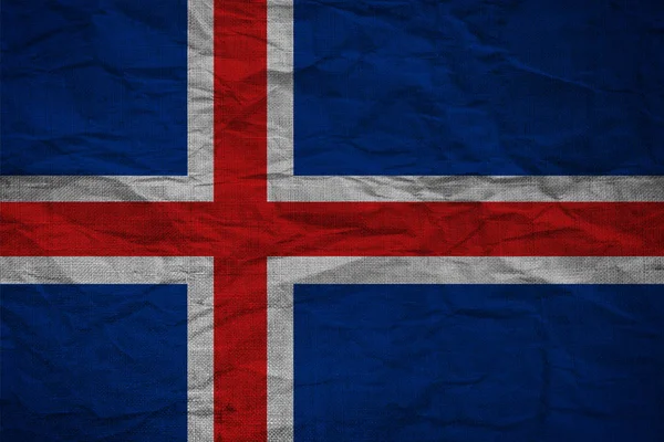 Isländische Flagge auf dem Hintergrund von Burlap — Stockfoto
