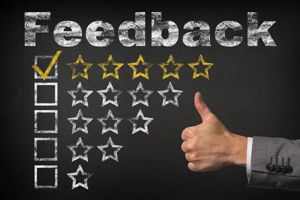 Feedback five 5 star rating. thumbs up service golden rating stars on chalkboard — Stock Photo, Image