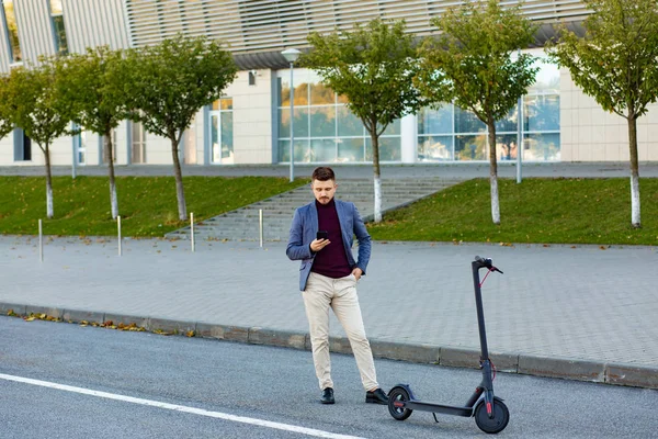 Young Handsome Man Holding Smartphone Preparing Click Rent Scooter Airport — Stock Photo, Image