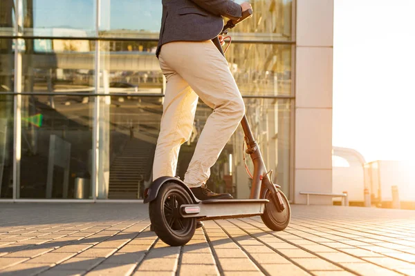 Legs Man Standing Scooter Parked Sidewalk Cityscape Sunset Trendy Urban — Stock Photo, Image