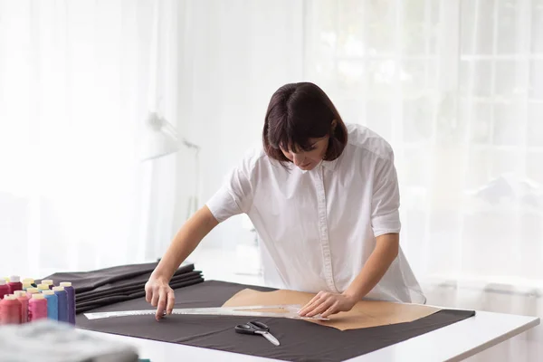 Close up portrait of fashion designer working in sewing studio. — 스톡 사진