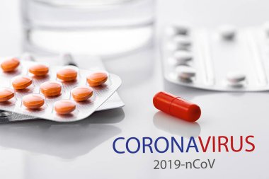 Coronavirus 2019-nCoV. Novel coronavirus, Middle East Respiratory Syndrome. Pills with CORONAVIRUS text. Chinese coronavirus outbreak. Virus Pandemic Protection Concept