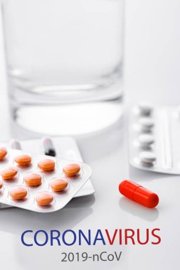 Coronavirus 2019-nCoV. Novel coronavirus, Middle East Respiratory Syndrome. Pills with CORONAVIRUS text. Chinese coronavirus outbreak. Virus Pandemic Protection Concept