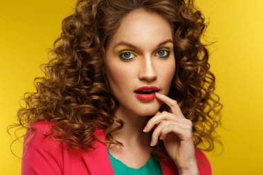 Wow. Reaction on unexpected news. Beautiful women with wide open eyes covering open mouth with hand, being surprised and shocked. Copy space,yellow background. Expressive faces. Body language concept