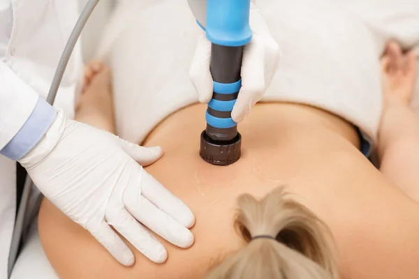 Extracorporeal Shockwave Therapy ESWT.Non-surgical treatment.Physical therapy for neck and back muscles,spine with shock waves.Pain relief, normalization and regeneration,stimulation healing process