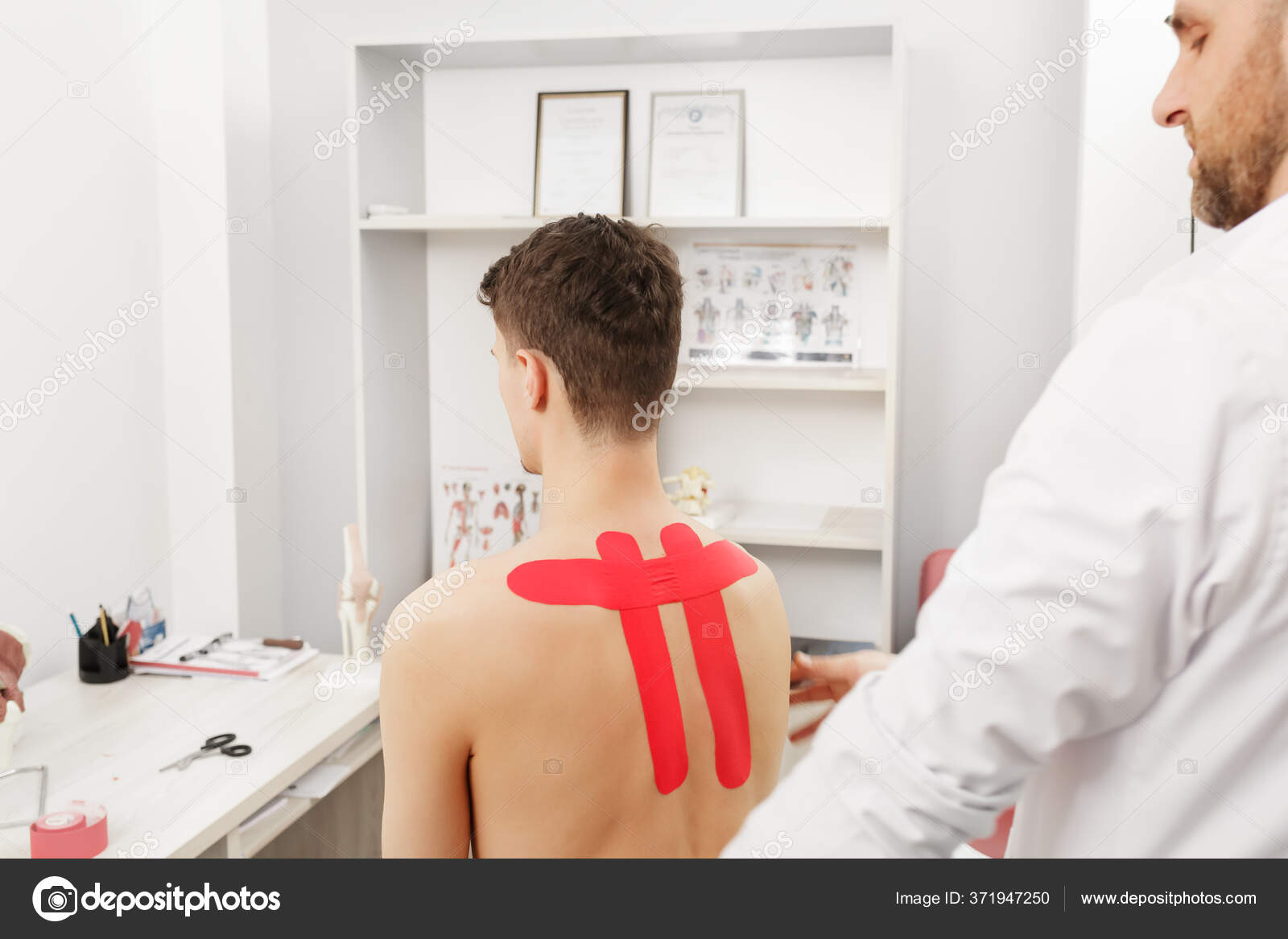 Kinesiology taping. Physical therapist applying kinesiology tape to patient neck. Therapist