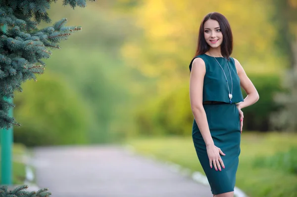 Smiling beautiful young woman wearing necklace posing outdoor Royalty Free Stock Photos