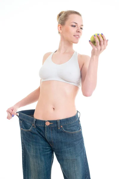 Loosing weight woman in big jeans showing thumb up. Slim body ca — Stock Photo, Image